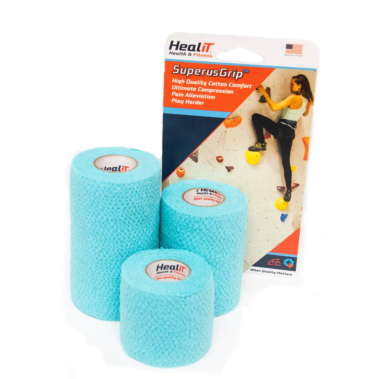 Three rolls of blue compression wrap athletic tape are placed in front of a retail package featuring a woman climbing a rock wall, with the brand HealIT visible on the packaging.