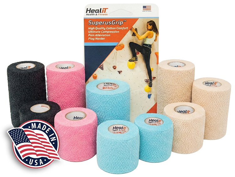 Assorted rolls of HealIT SuperusGrip athletic tape and compression wrap in black, pink, blue, and beige, displayed in front of product packaging and a Made in USA badge.