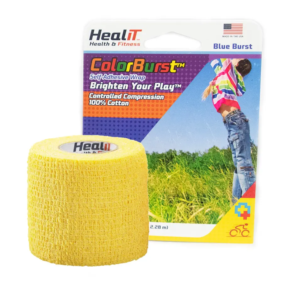 A yellow ColorBurst™ Compression Wrap is displayed in front of its packaging, which features a person jumping in a field and is branded by HealIT.