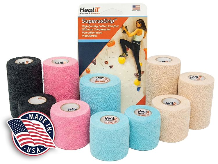 Assorted rolls of HealIT SuperusGrip athletic tape and compression wrap in black, pink, blue, and beige, displayed in front of product packaging and a Made in USA badge.